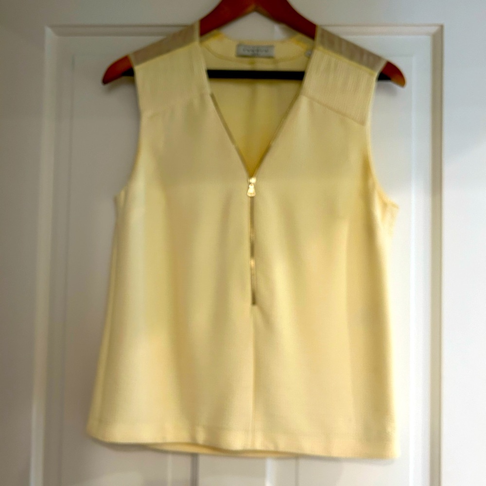 SANDRO sleeveless zip front blouse.